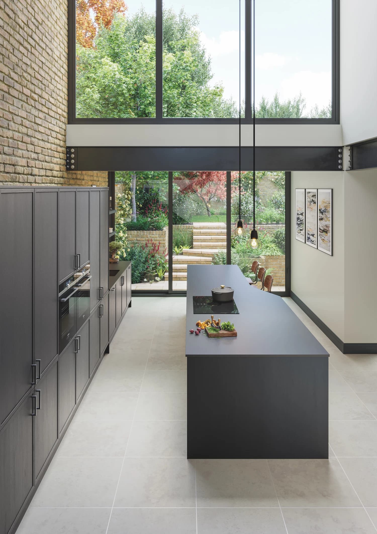 Aylesford Graphite contemporary dark grey shaker kitchen with island, exposed steel beam and full-height garden glazing, designed and fitted by The Cabinet Door Shop in Hove